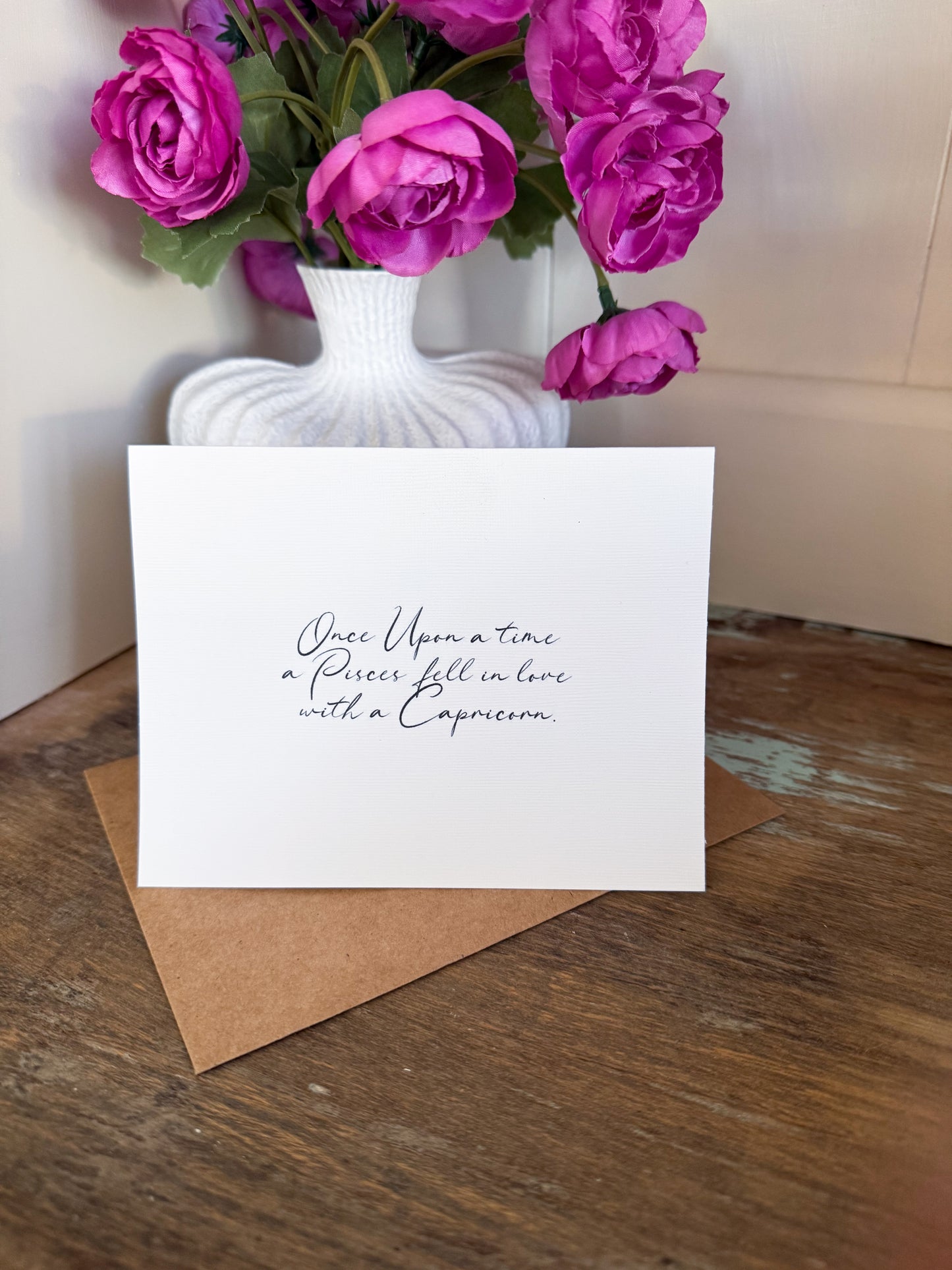 Pisces Loves Capricorn Greeting Card (Cursive)