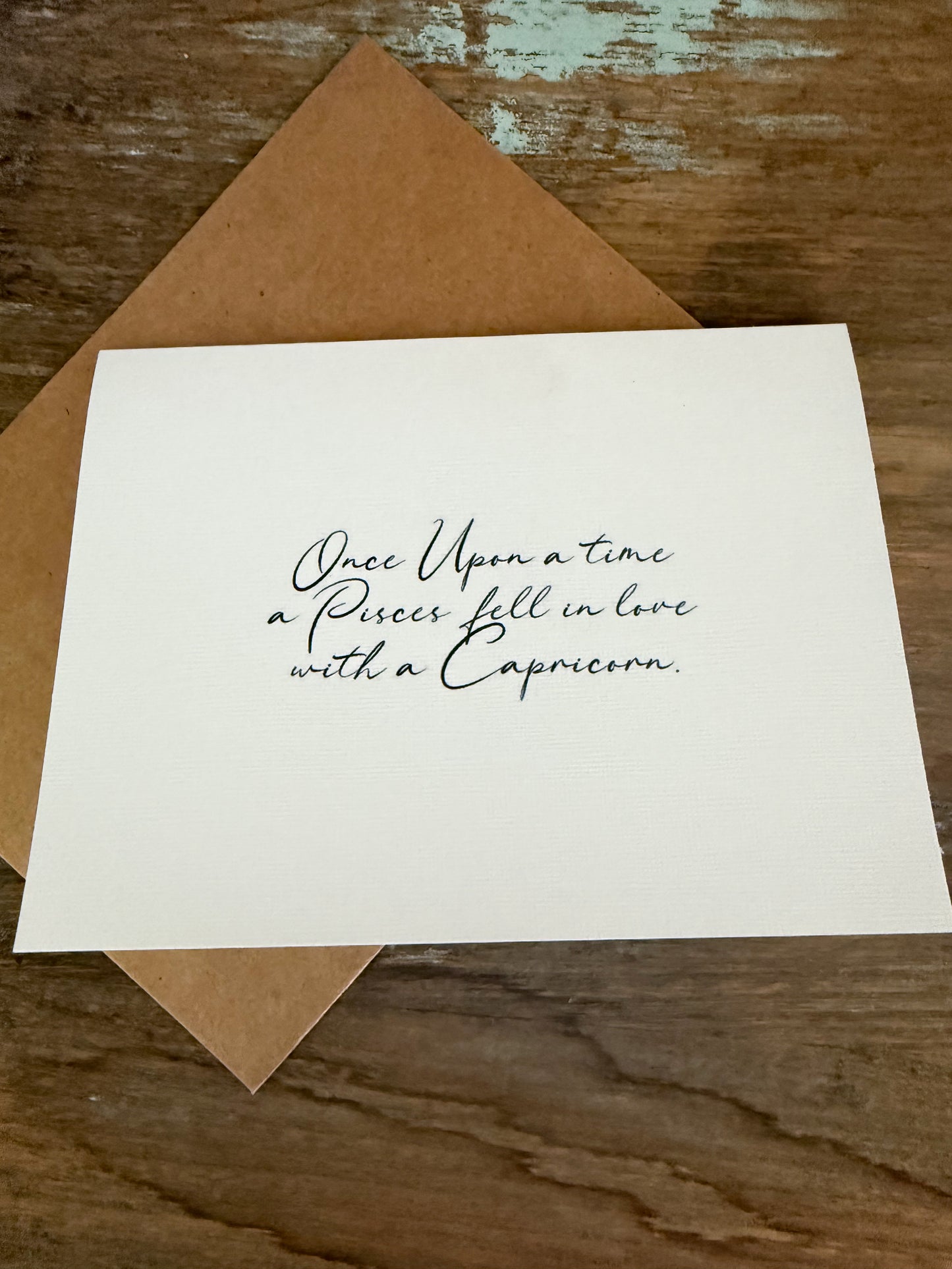 Pisces Loves Capricorn Greeting Card (Cursive)