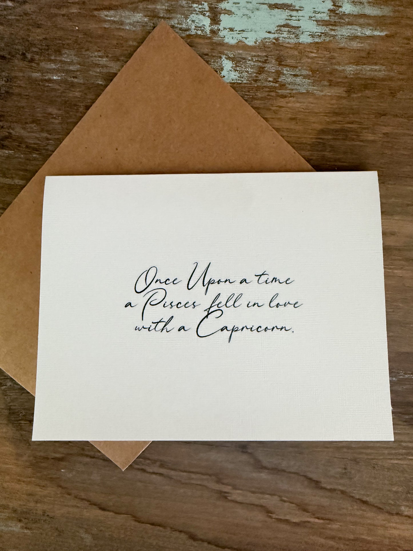 Pisces Loves Capricorn Greeting Card (Cursive)
